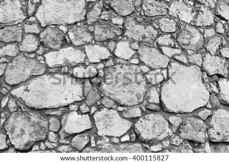 Grunge texture of old white stone walls of the castle for the background