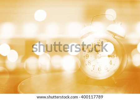 Retro alarm clock on  abstract bokeh light,soft color,blurred background