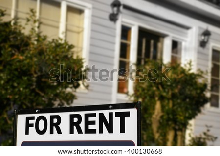 House  with "For Rent" sign in front