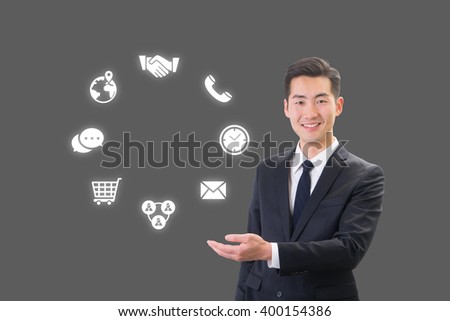 Success businessman showing business icon and chart concept