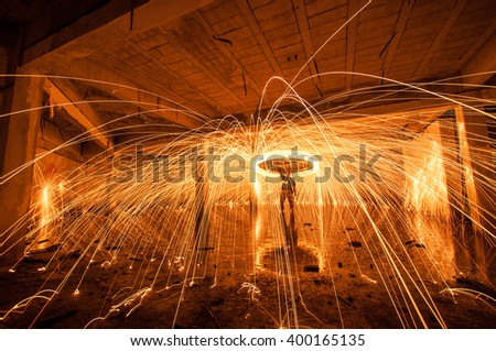 A circle of light dancing  in abandoned building.

