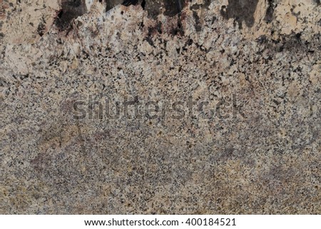 Peach Red Granite pale pink with white, gray and black patches. Building material for floors and walls, the manufacture of countertops, window sills and stairs. Background with natural stone texture.
