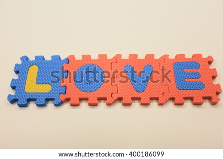  jigsaw placed on white background puzzle with a written word I LOVE YOU  