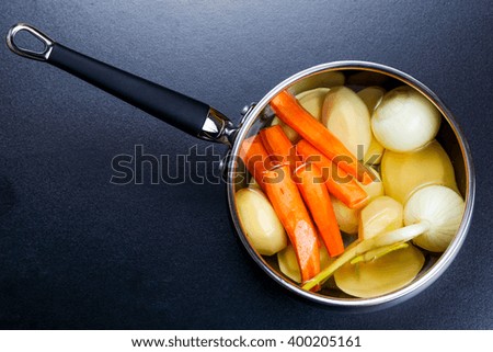 preparing vegetable stock bouillon in a pot