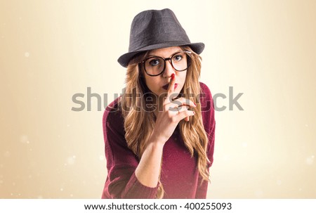 Hipster young girl making silence gesture