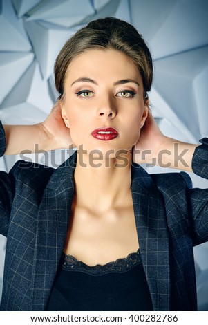 Portrait of a beautiful business lady wearing formal suit. Business style, fashion.