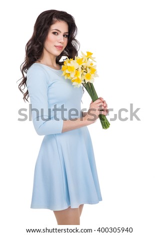 beautiful young woman with daffodils
