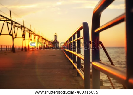 Lighthouse at sunset, St Joseph, Michigan Royalty-Free Stock Photo #400315096