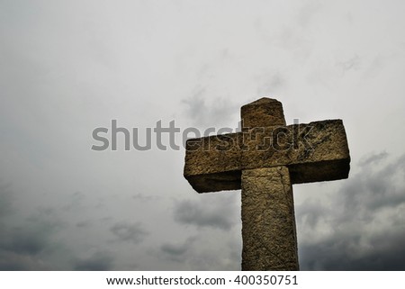 Big stone cross against the sky