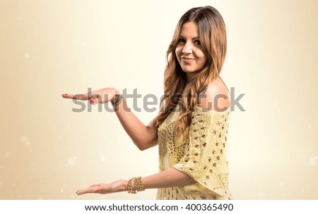 Pretty girl holding something