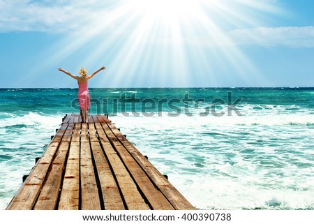 Girl on the bridge pier seashore