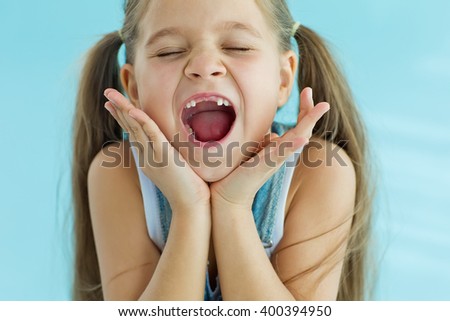 The child dropped the first milk tooth Royalty-Free Stock Photo #400394950