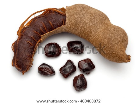Dried Tamarind Fruit Isolated on White Background in Full Depth of Field with Clipping Path.