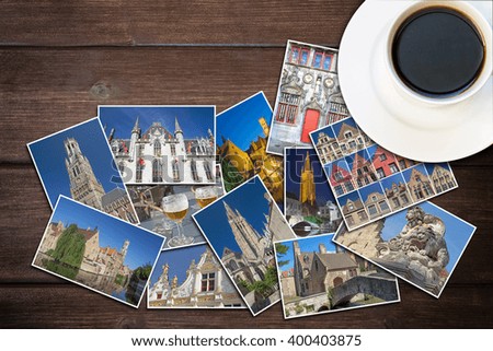White cup of coffee and photos from Bruges (Belgium) are lying on a wooden desk. Photo is edited as vintage with dark edges.