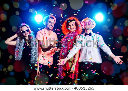 Group of cheerful friends having fun on a party. Holidays, celebration. 
