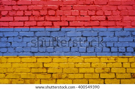 Flag of Armenia painted on brick wall, background texture
