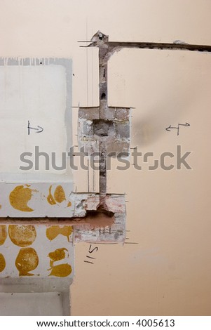 Channels cut into the wall for power and powerpoints