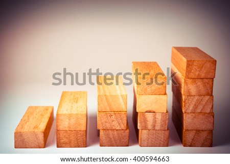 Tower Game with a Wooden. Wood block stacking as step stair. Business concept for growth success process. - Vintage tone.