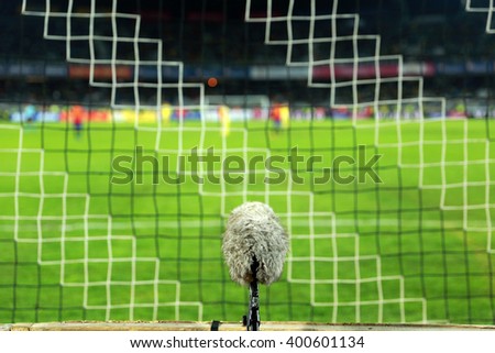 Professional sport microphone on a soccer field behind the net