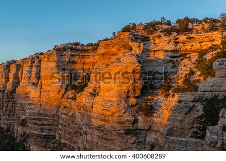 Orange painted rocks of hills by the sunset landscape in the Grand Canyon, USA