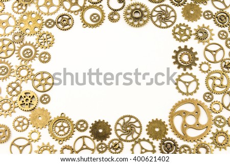 metallic gears background / Closeup of metal cog gears / close up texture pattern steampunk style and old mechanical peaces / decorative frame