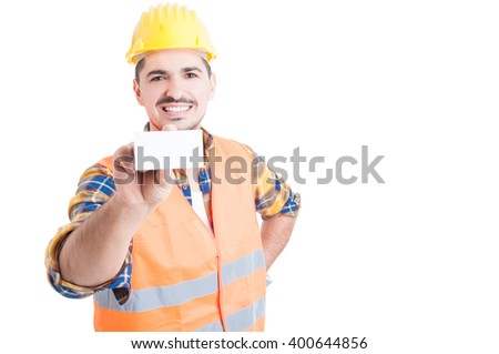 Handsome engineer showing blank business card and smiling on white background with copy space