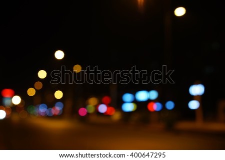Artistic style - Defocused urban abstract texture bokeh city lights in the background with blurring lights