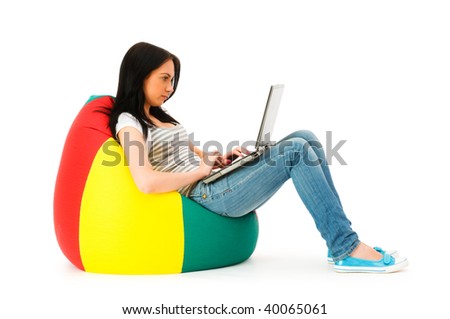 Girl working on laptop isolated on white