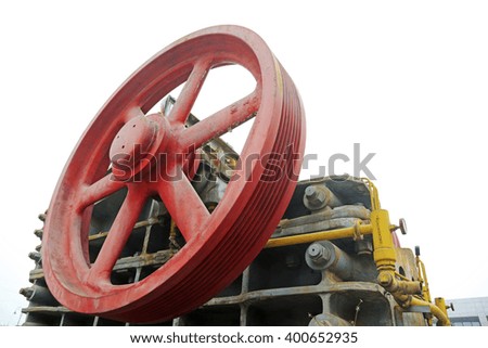 abandoned large mechanical equipment wheel, closeup of photo
