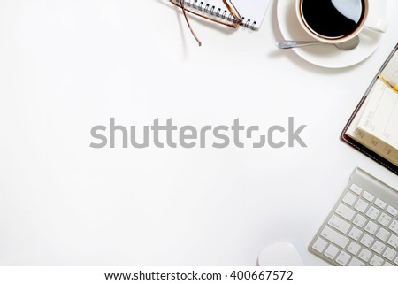 Top view of Business desk, work place with cup of coffee,Empty workspace on white table.