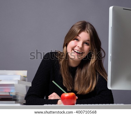 Young woman in an office working on a computer
