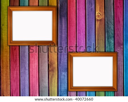 colorful wooden wall with two frames