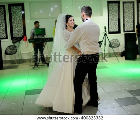 bride and groom dancing on the own wedding