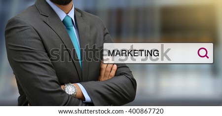 Professional standing in front of office with marketing search bar illustrations