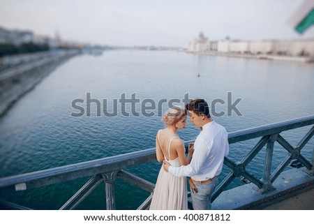 gorgeous wedding couple walking in the old city of Budapest