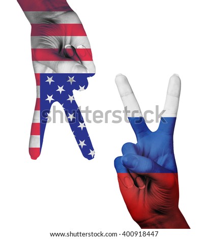 Hands making the V sign with painted flag