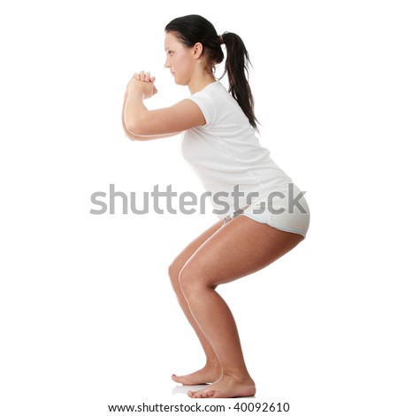 Puffy young woman exercise. Isolated on white background
