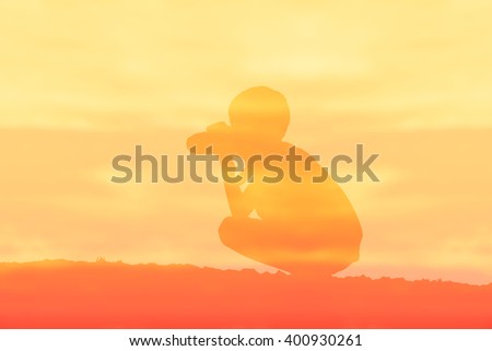 Silhouette of boy photography over sepia color style background.