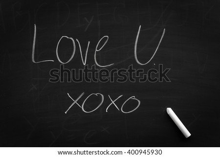 Write about love you on blackboard for background. Empty blank black chalkboard with chalk traces