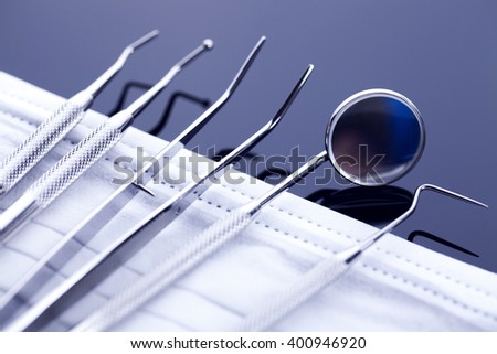 Professional dental tools in a sterile medical light