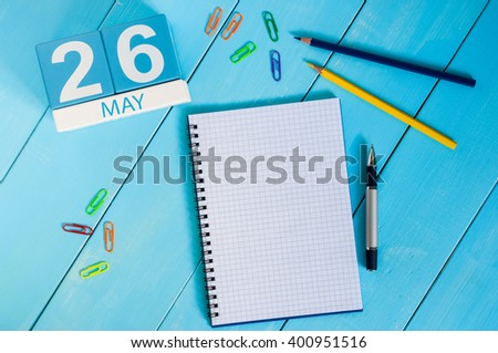 May 26th. Image of may 26 wooden color calendar on blue background.  Spring day, empty space for text