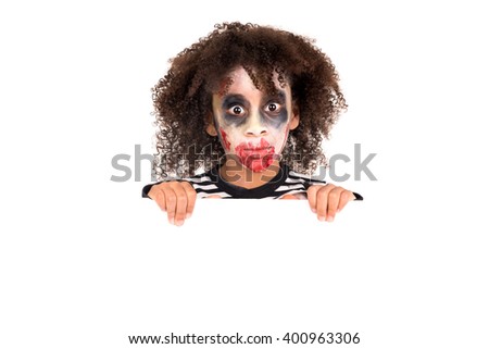 Young girl Zombie with face-paint in Halloween over a white board