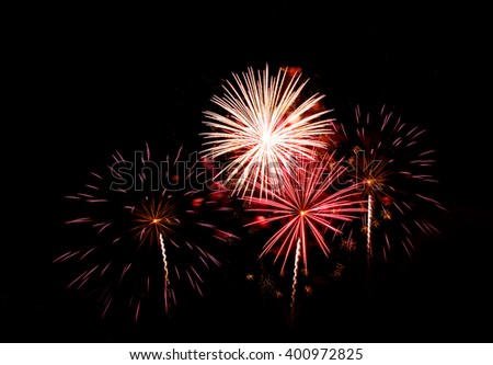Colorful fireworks of various colors over night sky, Vibrant color effect