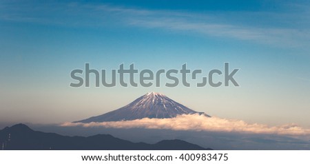 cream tone photo style of mountain fuji  in japan with cloud below look like mountain floating