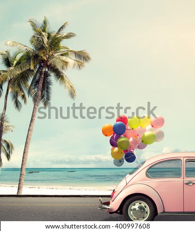 Vintage card of car with colorful balloon on beach blue sky concept of love in summer and wedding honeymoon