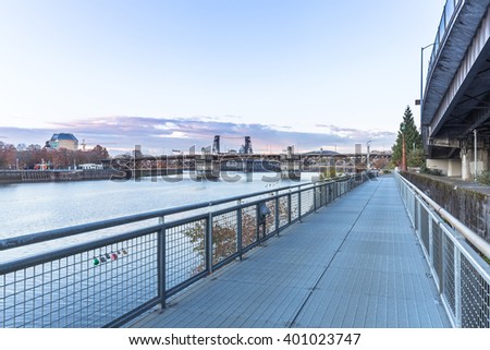 empty steel footpath near river and bridge and skyline in portland