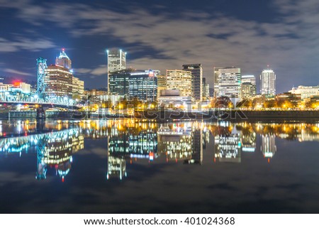 water with reflection and cityscape and skyline of portland at night