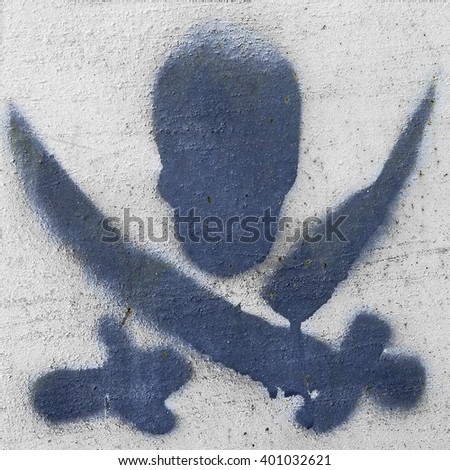 Pirates symbol graffiti on a white plastered surface