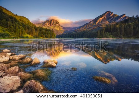 Fantastic views of the turquoise Lake Obersee under sunlight. Dramatic and picturesque scene. Location famous resort: Nafels, Mt. Brunnelistock, Swiss Alps. Europe. Artistic picture. Beauty world. Royalty-Free Stock Photo #401050051