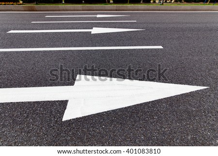 White directional signs on the highway
